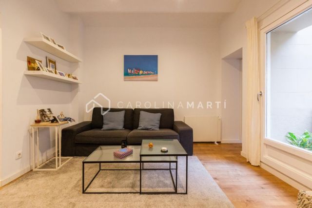 Appartement avec terrasse à vendre à Plaza Molina – 2 chambres, cuisine ouverte et beaucoup de lumière naturelle